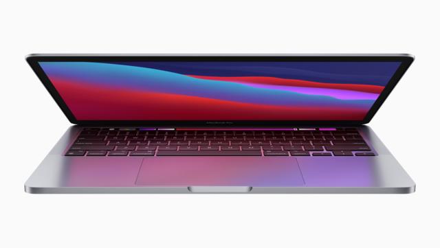 Partially opened MacBook Pro laptop Partially opened MacBook Pro laptop